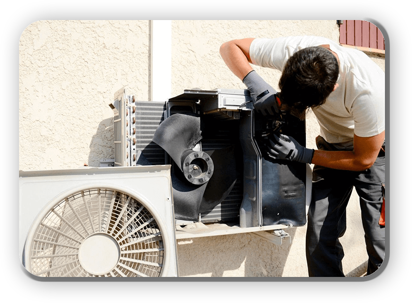 A man working on an air conditioner outside.